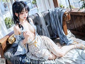 A woman in a blue dress sitting on a wooden bench.