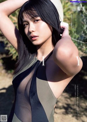 a japanese woman in a white dress posing for the camera