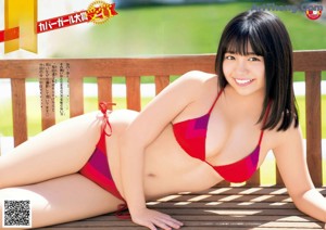 a japanese woman in a bikini is posing for the camera